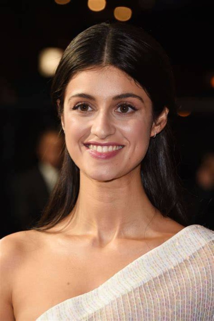 Wow! The Witcher star Anya Chalotra wowed in a plunging black gown as she joined her boyfriend Josh Dylan at the Netflix show's season three premiere in London